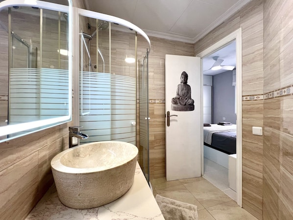 Shower, hair dryer, towels, soap