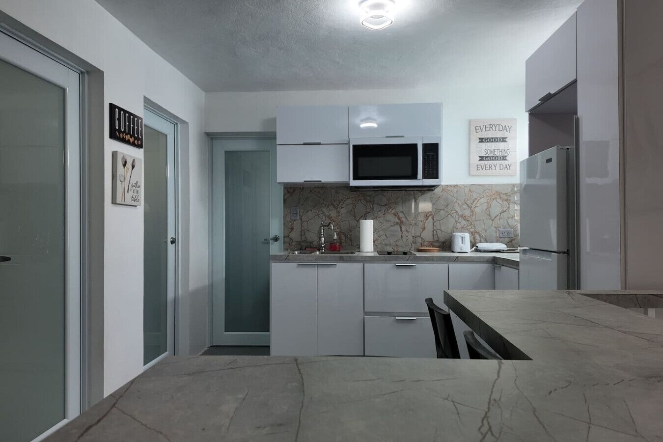 Fridge, microwave, stovetop, coffee/tea maker
