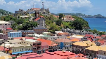 A coastal town with colorful buildings and a clear blue sky.