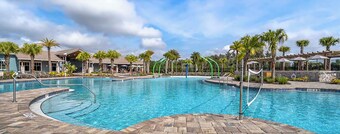 Spacious 4-bed townhome with AC. Beautiful resort style pool and fitness center