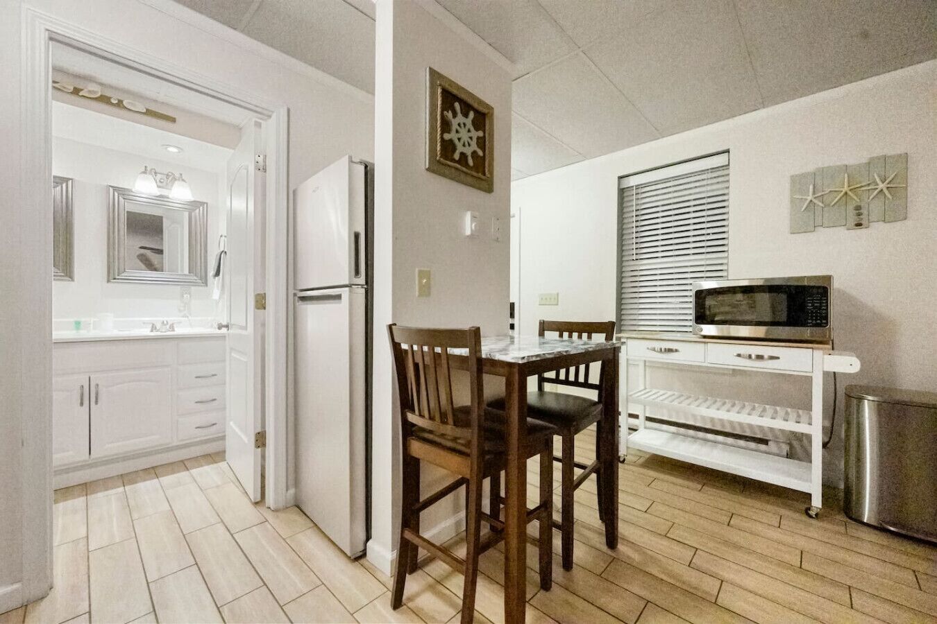 Fridge, microwave, coffee/tea maker, cookware/dishes/utensils