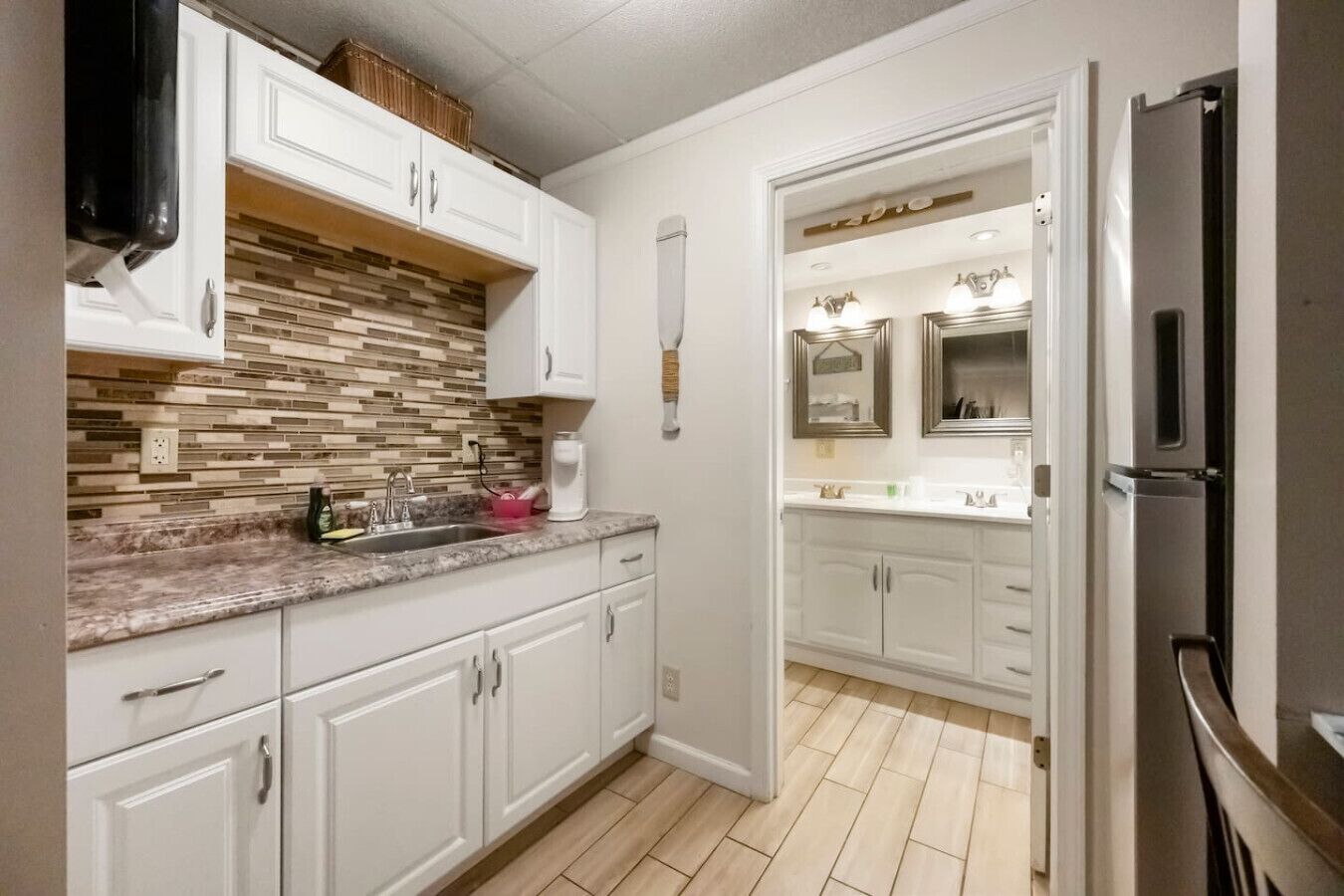 Fridge, microwave, coffee/tea maker, cookware/dishes/utensils