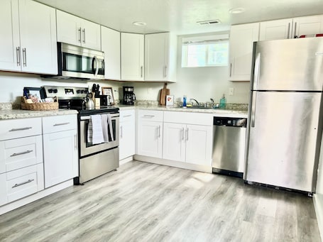Private kitchen. Clean Modern Apartment-75” SMART TV & Xbox