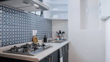 Departamento Confort, 3 habitaciones | Cocina privada | Refrigerador con congelador, microondas, parrilla de estufa y tostadora