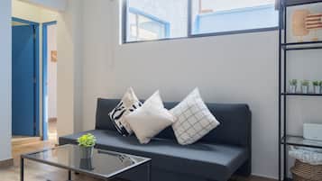 Comfort Apartment, 1 King Bed with Sofa bed | Living area | 55-inch Smart TV with digital channels