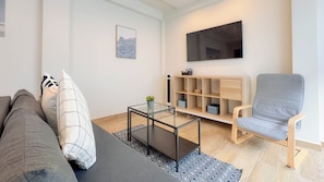 Apartamento conforto, 3 quartos | Área de estar | Impressoras