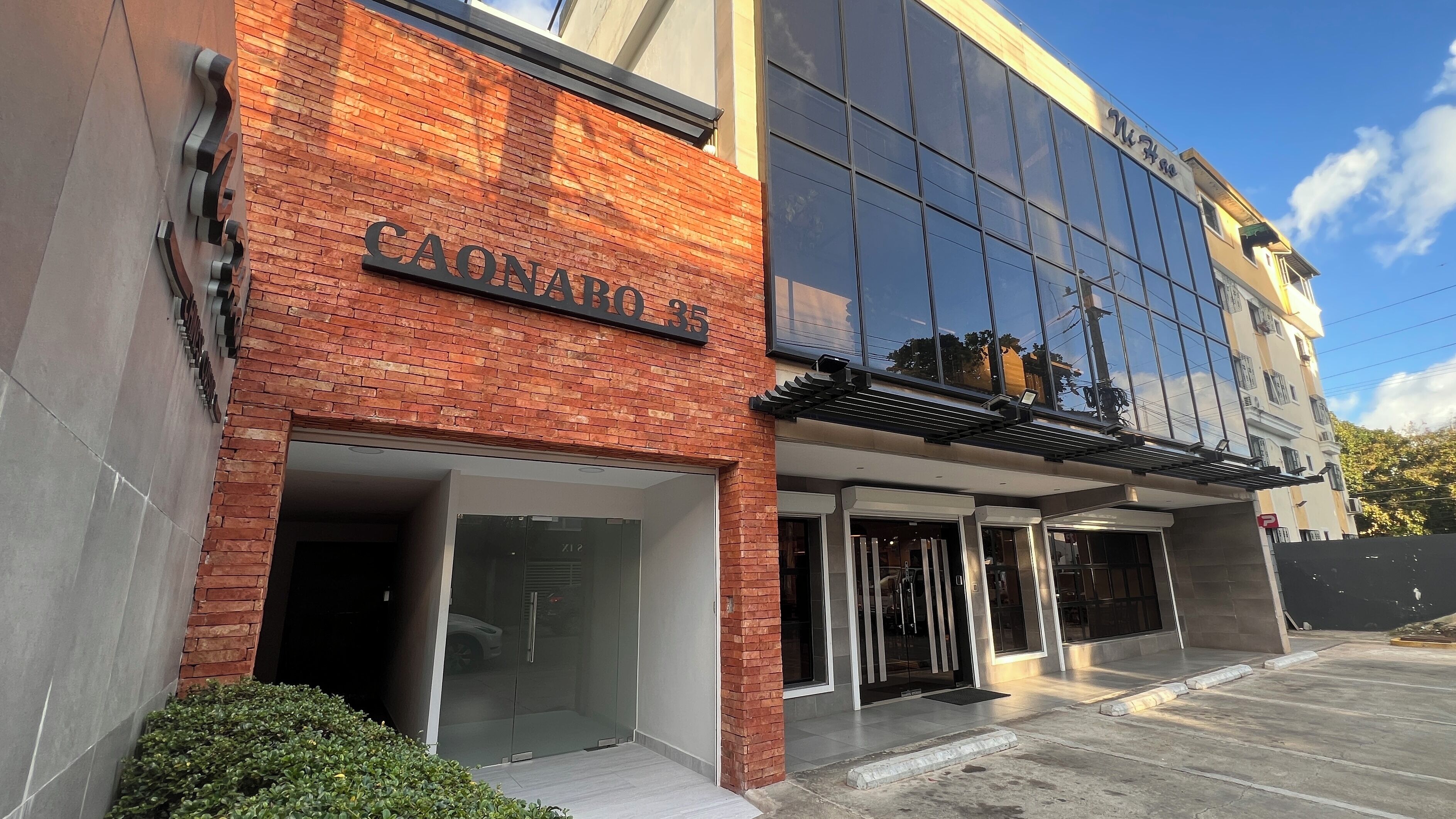 A building with a brick facade and a glass entrance.
