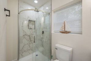 Shower, towels, soap, toilet paper