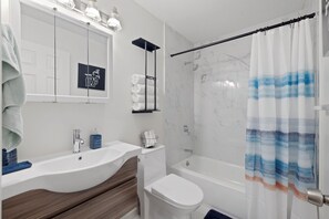 Shower, hair dryer, towels, soap - Fully Renovated & Private 2-bedroom home in Zephyrhills with Porch (Zephyrhills)
