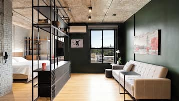 Apartamento Deluxe, 1 cama de matrimonio con sofá cama, bañera de hidromasaje | Zona de estar