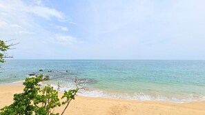 On the beach, sun-loungers, beach towels