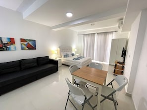 Deluxe Studio, Balcony, Resort View | Private kitchen | Fridge, stovetop, coffee/tea maker, dining tables