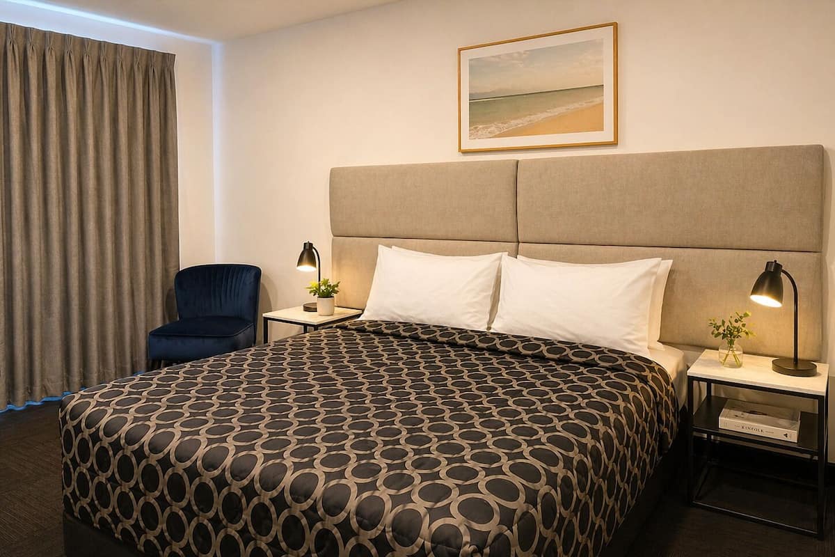 Desk, laptop workspace, blackout drapes, iron/ironing board