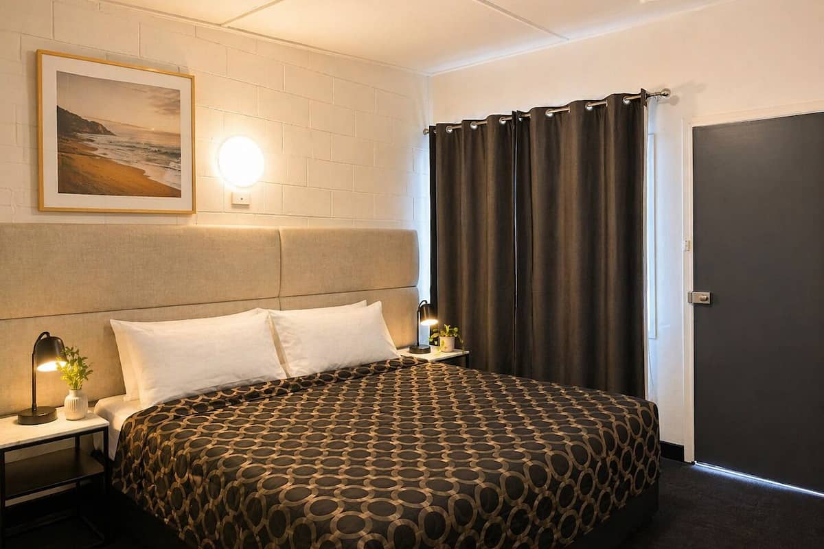 Desk, laptop workspace, blackout drapes, iron/ironing board