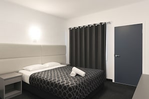 Desk, laptop workspace, blackout curtains, iron/ironing board
