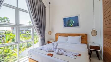 Deluxe Townhome, Pool View | In-room safe, desk, laptop workspace, iron/ironing board