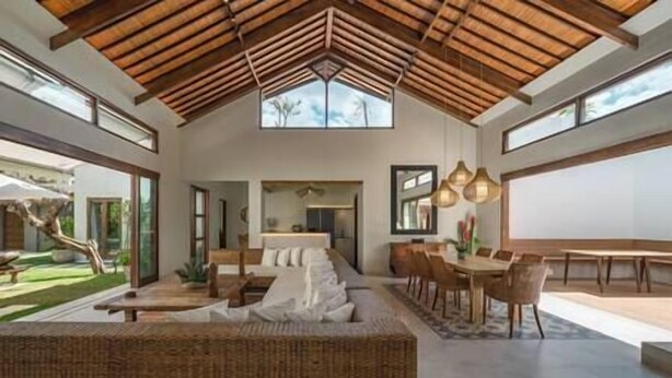 A spacious interior with a high ceiling, a dining area, and a seating area. - Villa Emmy | Elegant Seminyak 4BR Villa — Pool & Private Chef (Seminyak)