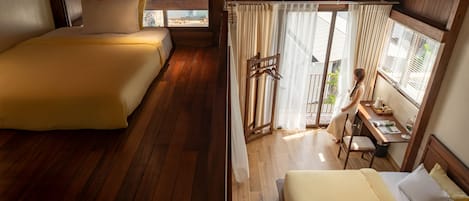 Deluxe Quadruple Room, Balcony | Desk, laptop workspace, free WiFi, bed sheets