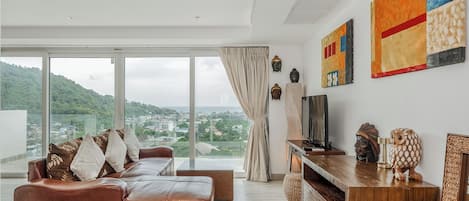 Apartamento, balcón | Zona de estar