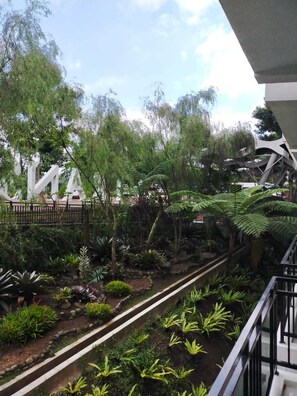 Deluxe Triple Room, Garden View | Terrace/patio