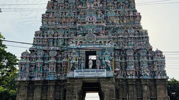 A temple entrance with intricate carvings and statues.
