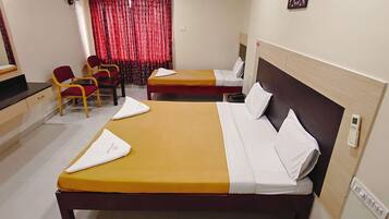 Deluxe Triple Room, City View | Down duvets, individually furnished, desk, laptop workspace