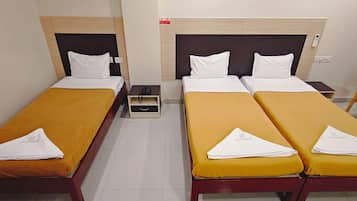 Deluxe Triple Room, City View | Down duvets, individually furnished, desk, laptop workspace