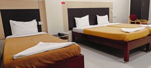 Deluxe Triple Room, City View | Down comforters, individually furnished, desk, laptop workspace