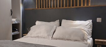 Warm, modern studio with designer staircase.