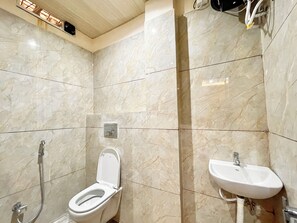 Shower, rainfall showerhead, bidet, towels