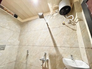 Superior Triple Room | Bathroom | Shower, rainfall showerhead, bidet, soap - Hotel Satyam Palace - near Temple (Ujjain)