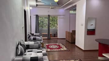 Suíte conforto, sacada | Área de estar