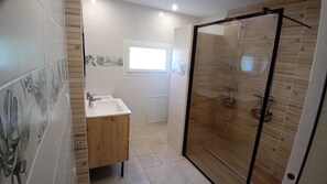 Shower, hair dryer, towels, toilet paper