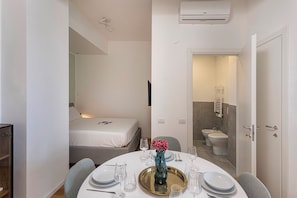Apartment, 1 Queen Bed with Sofa bed, Partial Sea View | Bathroom | Shower, hair dryer, towels, soap