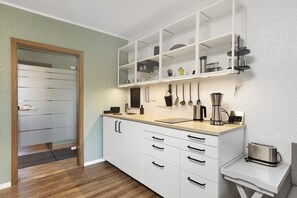 Fridge, stovetop, coffee/tea maker, electric kettle