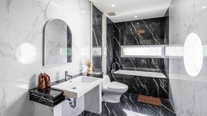 A modern bathroom with a marble vanity, a toilet, and a sink. - Orivista NEW! Luxe Private Pool Villa w Rooftop (Mengwi)
