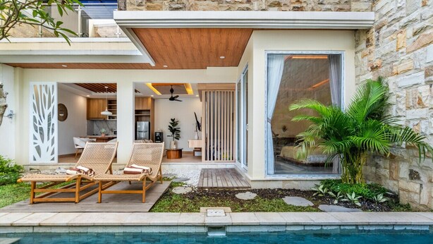 A modern house with a pool, outdoor seating, and a stone exterior. - Orivista NEW! Luxe Private Pool Villa w Rooftop (Mengwi)