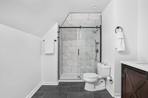 Shower, hair dryer, towels, shampoo