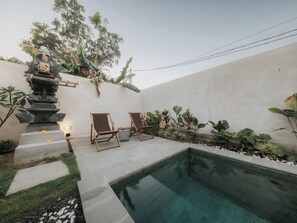 Outdoor pool, pool umbrellas, pool loungers