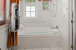 Jetted tub, hair dryer, towels, soap