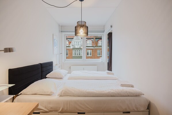 1 bedroom, desk, iron/ironing board, travel crib