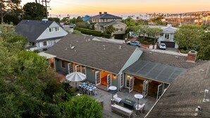 A residential property with a patio, outdoor seating, and a view of the ocean. - Coastal Elegance by the Shore (La Jolla)