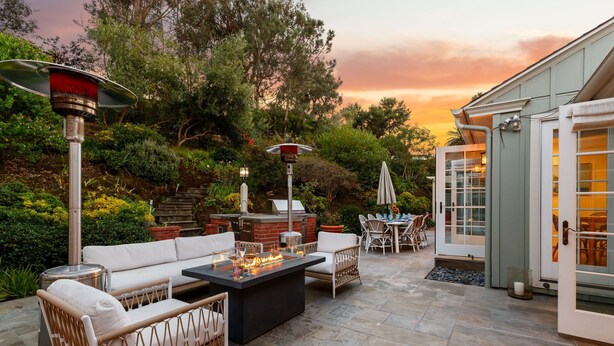 An outdoor patio with a fire pit, seating, and a grill. - Coastal Elegance by the Shore (La Jolla)