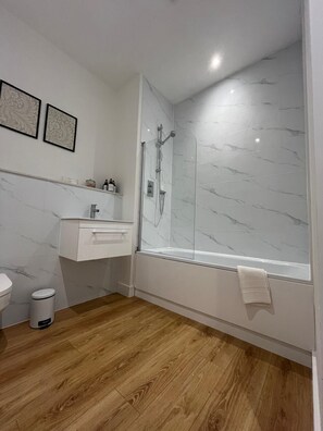 Shower, towels, soap, toilet paper