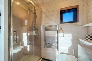 Shower, eco-friendly toiletries, hair dryer, towels
