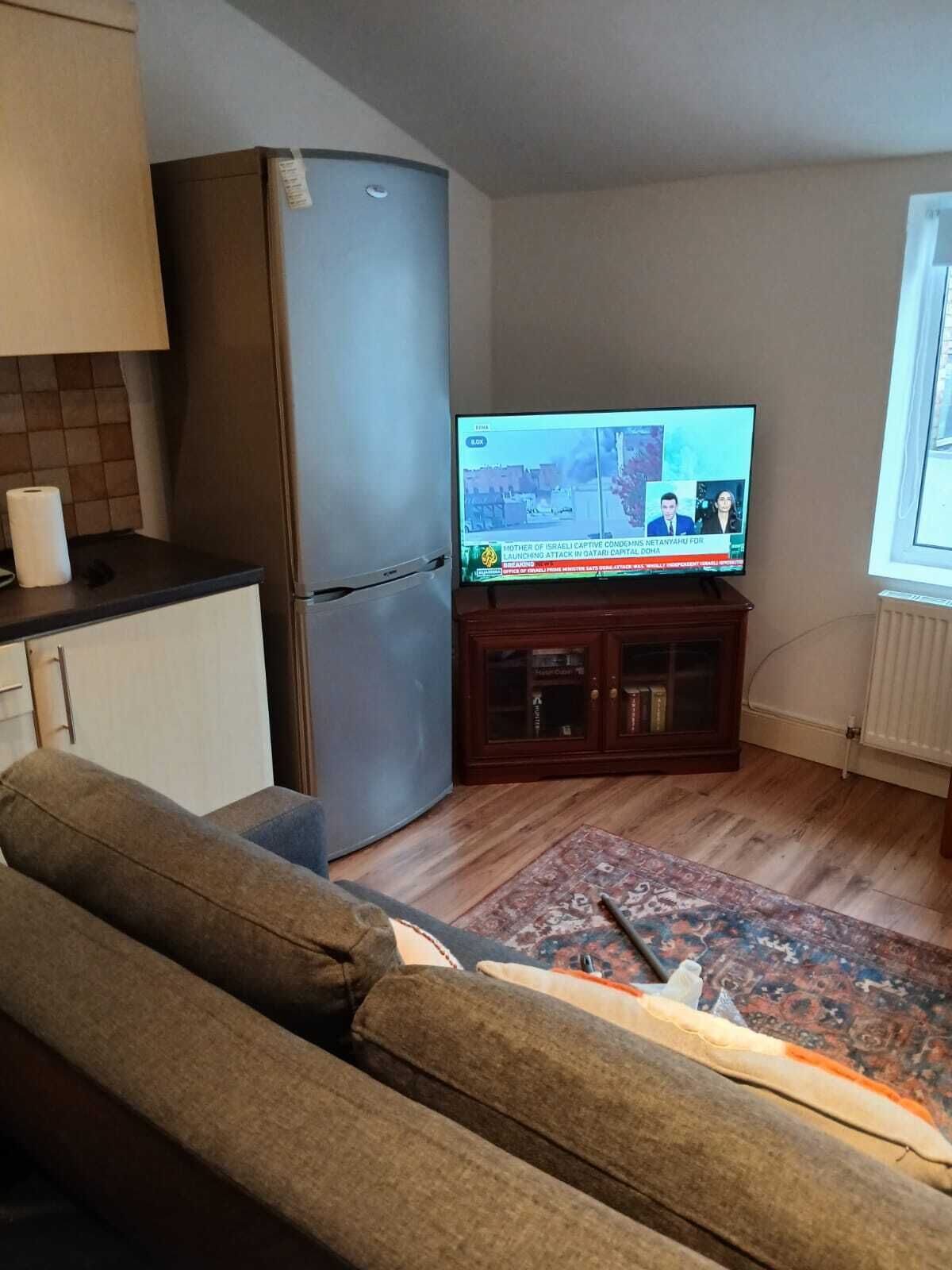Apartamento, 1 quarto | Sala de estar | Livros