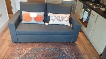 Apartment, 1 Bedroom | Living room | Books