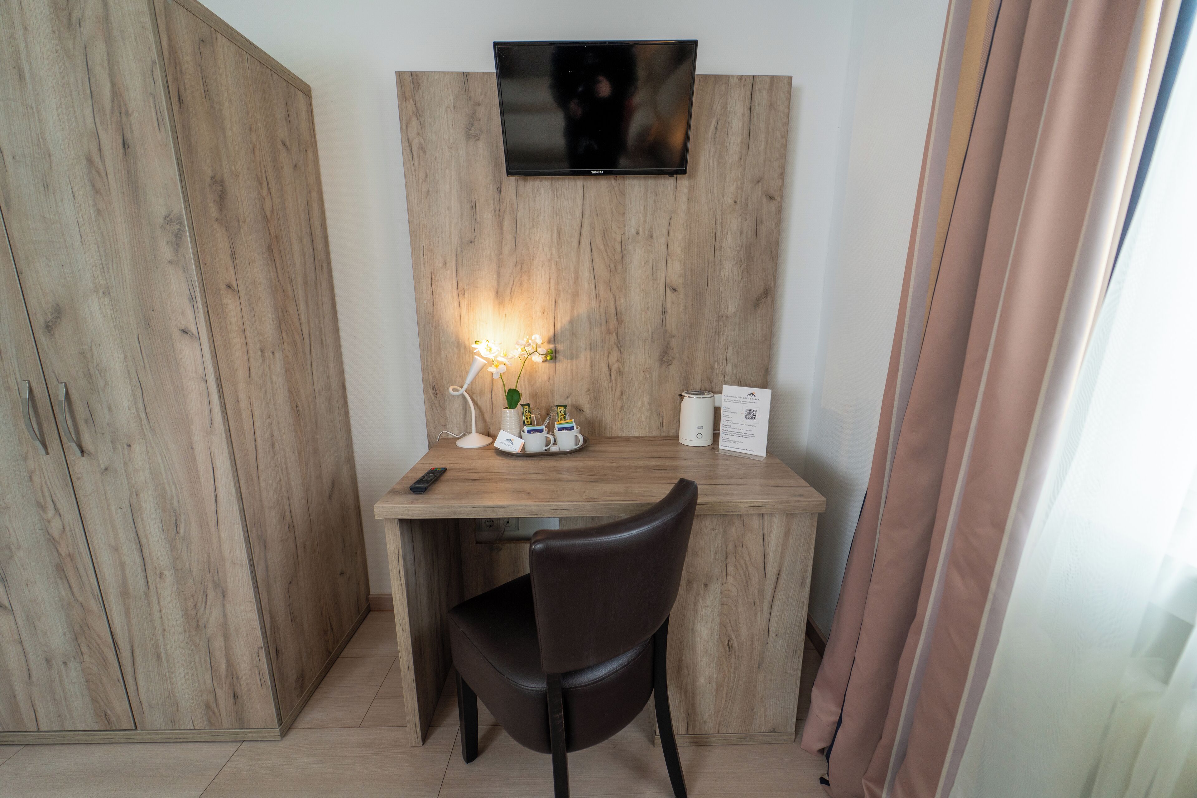 Desk, laptop workspace, blackout drapes, soundproofing