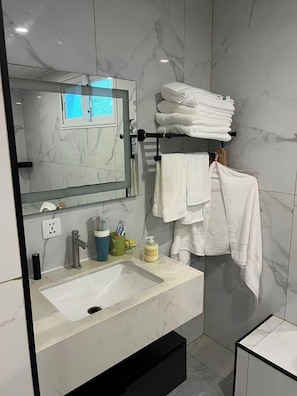 Shower, hair dryer, towels, soap