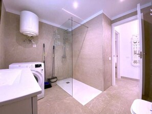 Shower, hair dryer, towels, soap